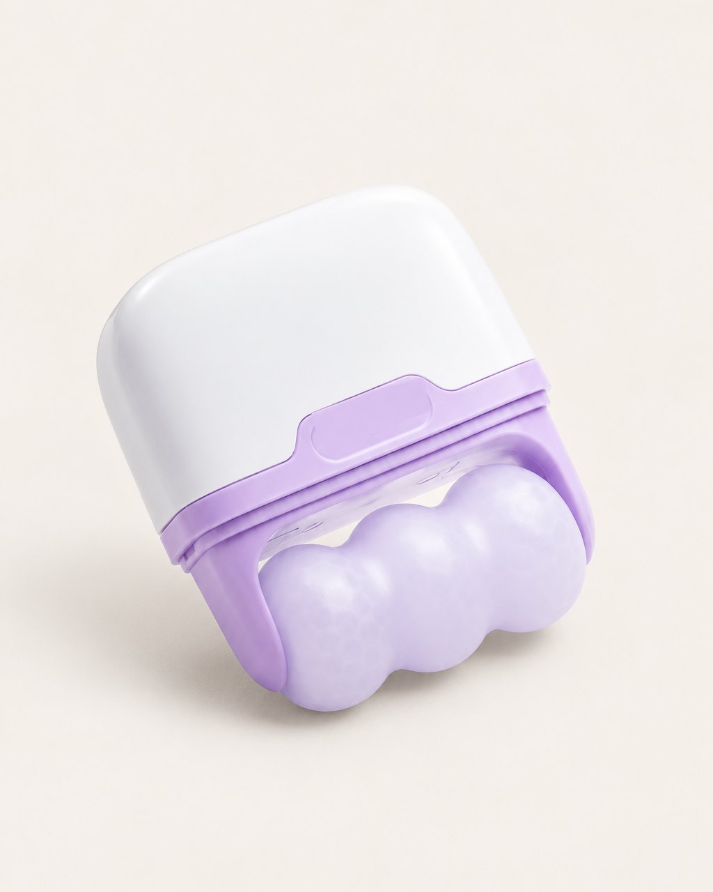 Lilac and white double ice roller with its cap off, showing the twin rollers, on a light background