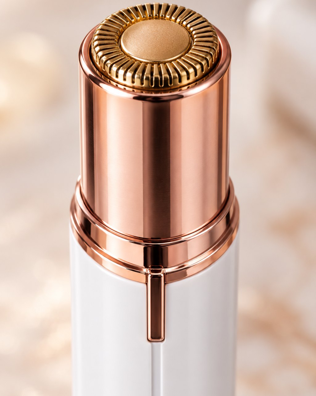 Close-up of the round gold-tone head with its slotted guard