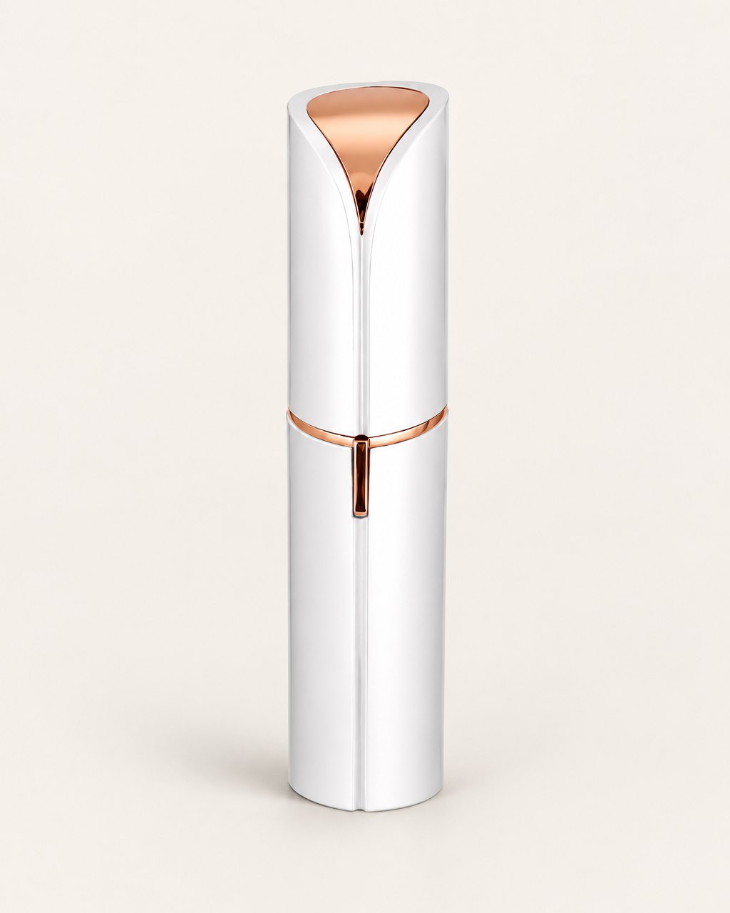 White facial hair remover with its cap on, shaped like a lipstick, on a light background