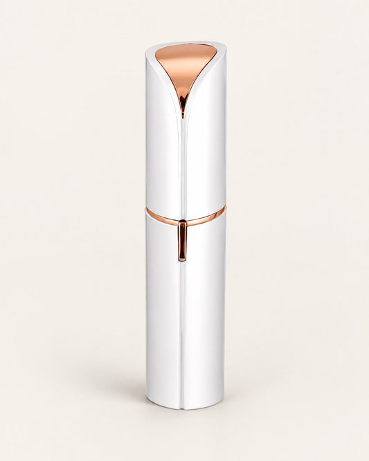 White facial hair remover with its cap on, shaped like a lipstick, on a light background