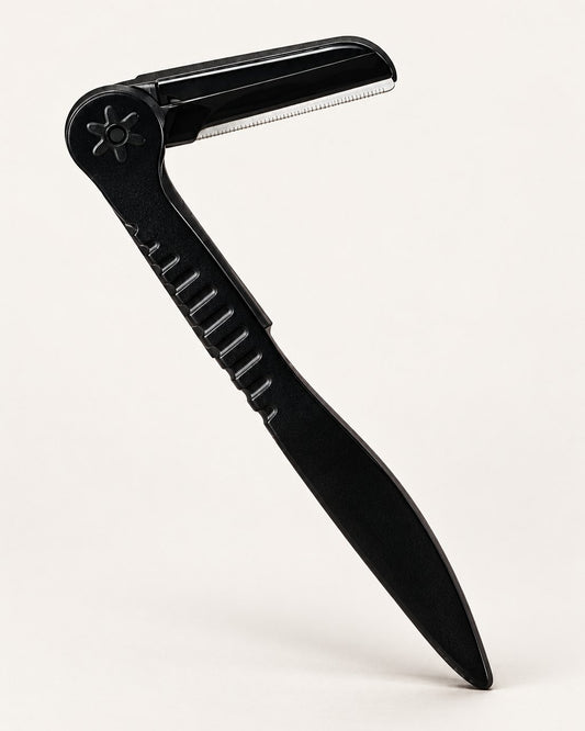 Black folding brow razor shown open on a light background