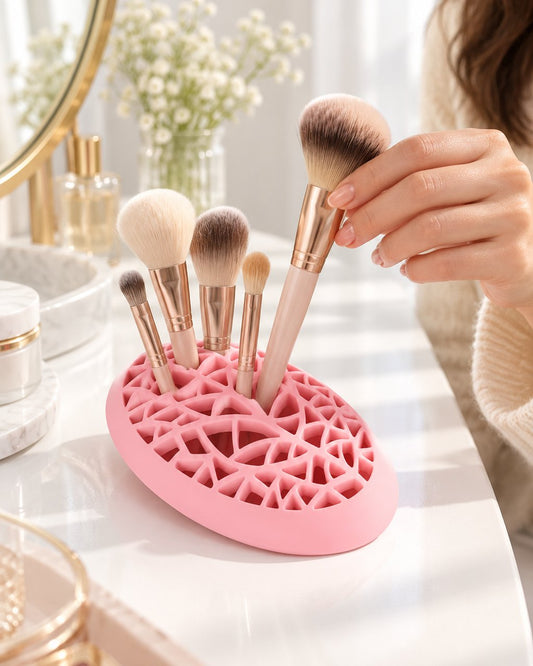 Hand pulling a makeup brush from the pink lattice holder