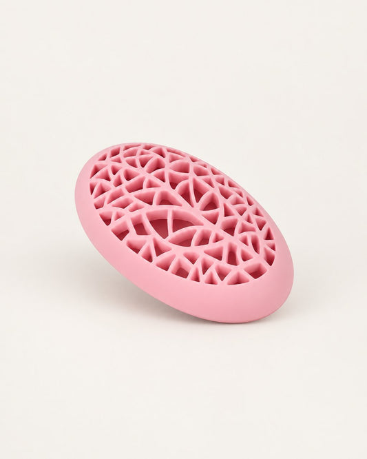 Pink egg-shaped silicone brush holder with a lattice lid