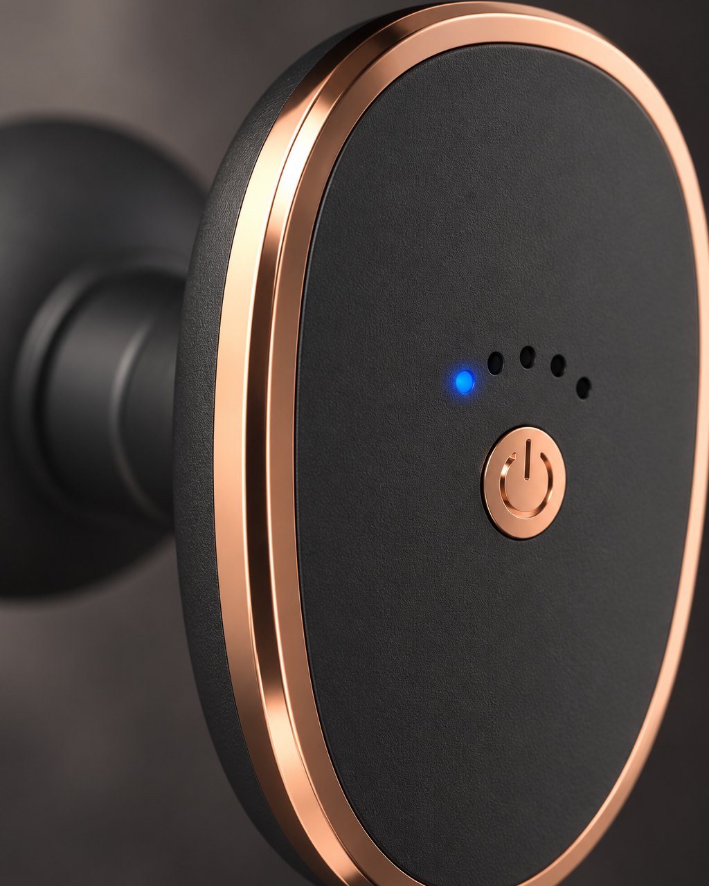 Close-up of the gun's power button, small indicator lights and rose-gold-tone trim