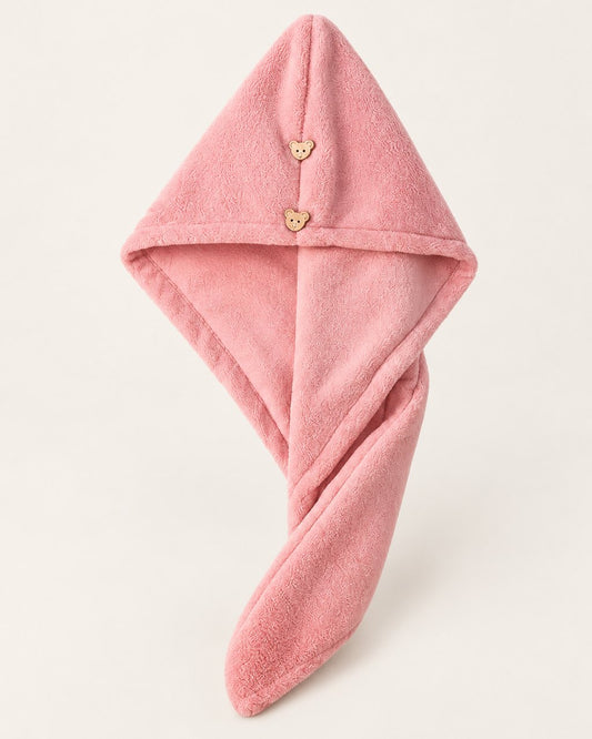Pink double-layer hair towel wrap with two small bear-shaped buttons, on a light background