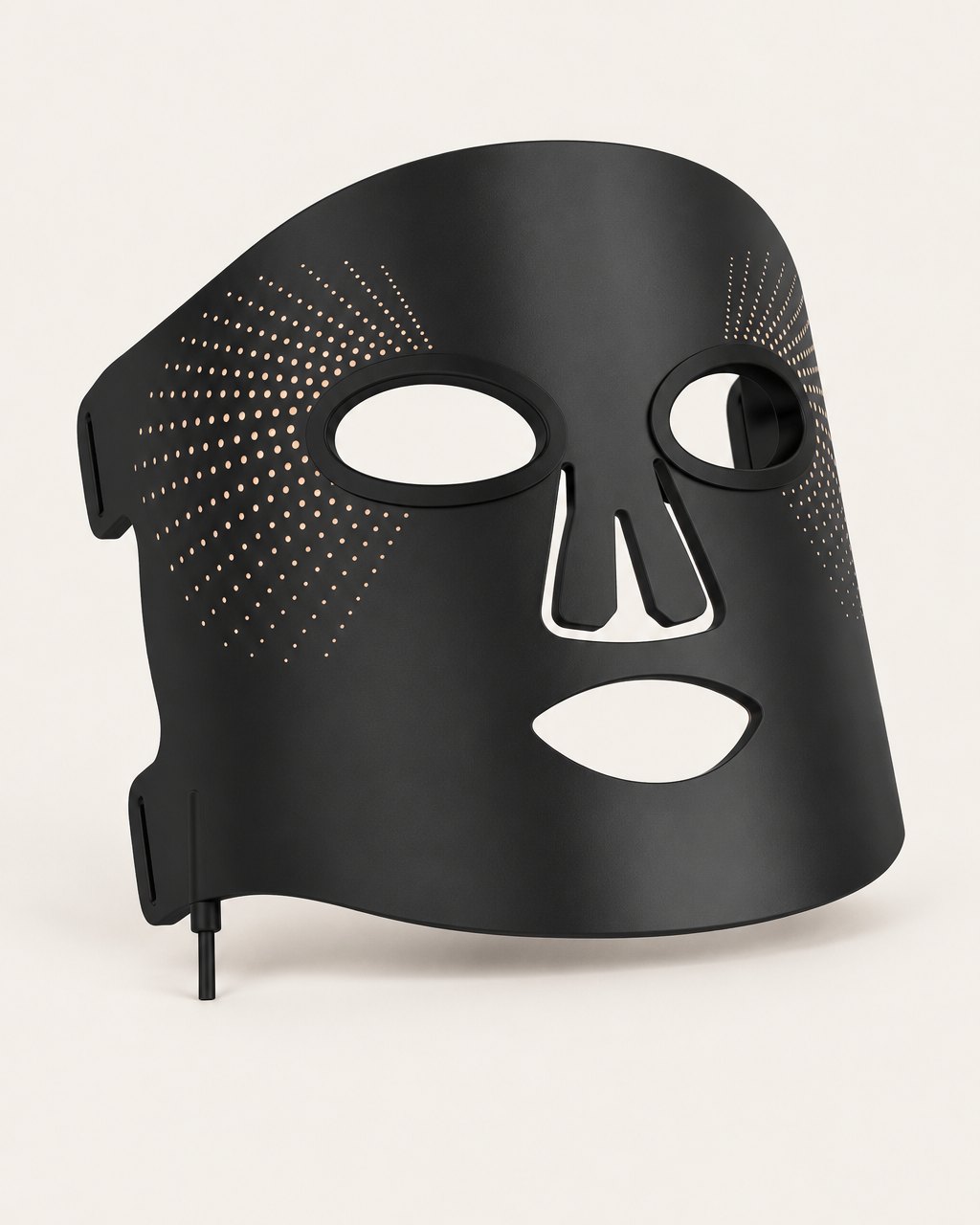 Black flexible silicone LED face mask on a light background