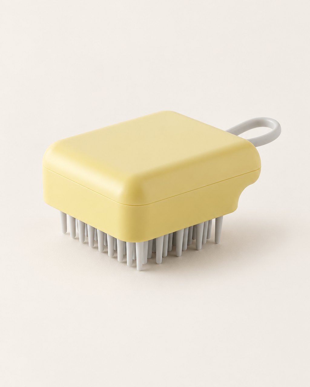 Yellow scalp shampoo brush with grey bristles